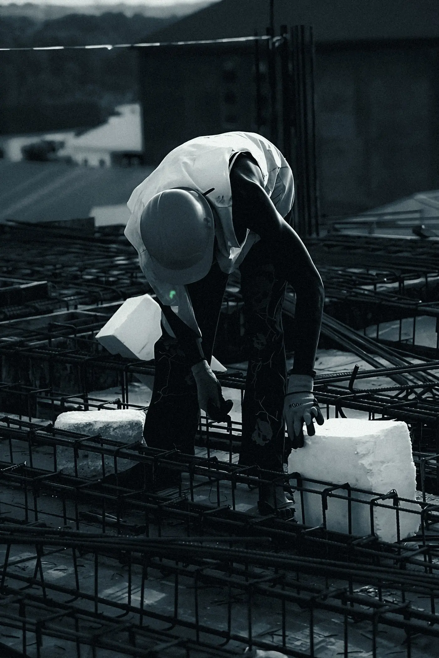 Steel fixer at work on a reinforcement cage