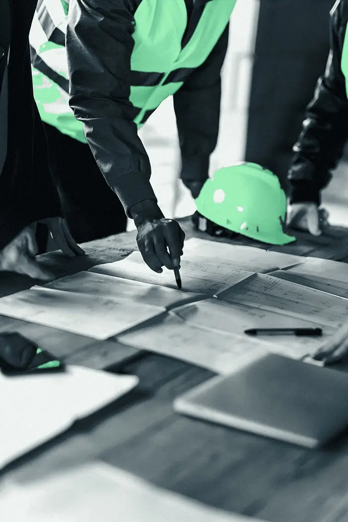 Engineers reviewing drawings on site
